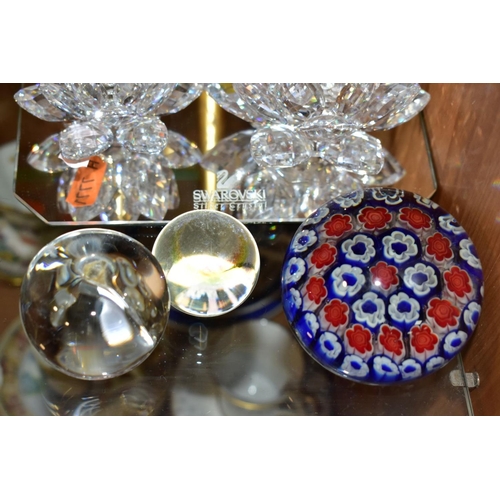 453 - THREE SWAROVSKI CRYSTAL CANDLEHOLDERS AND THREE GLASS PAPERWEIGHTS, comprising three Swarovski Water... 