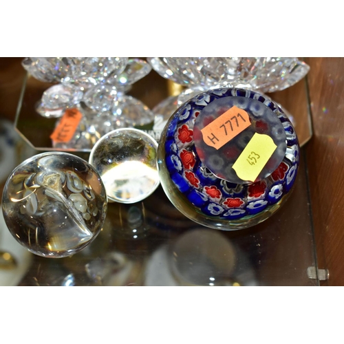 453 - THREE SWAROVSKI CRYSTAL CANDLEHOLDERS AND THREE GLASS PAPERWEIGHTS, comprising three Swarovski Water... 