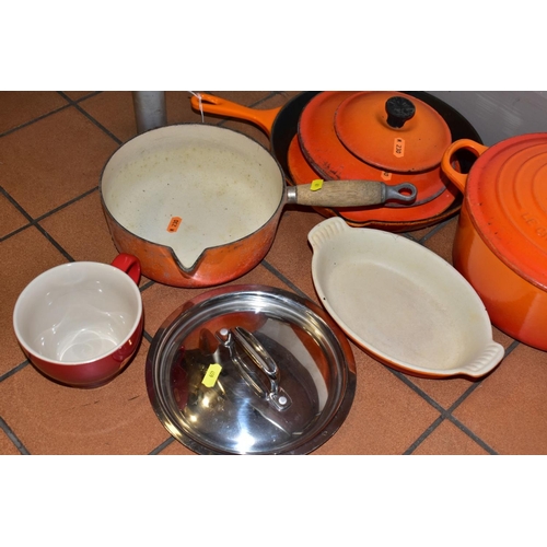 459 - A GROUP OF LE CREUSET CAST IRON COOKWARES, to include an oval casserole dish, a large circular casse... 