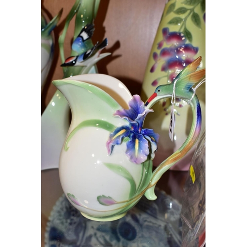 461 - FIVE PIECES OF FRANZ PORCELAIN, comprising a jug with Hummingbird handle and Iris flower, height 17.... 