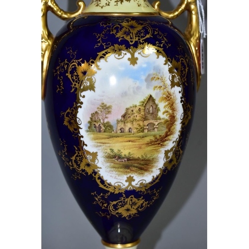 468 - AN EARLY 20TH CENTURY COALPORT TWIN HANDLED PEDESTAL VASE AND COVER, the pale yellow, blue and gilt ... 