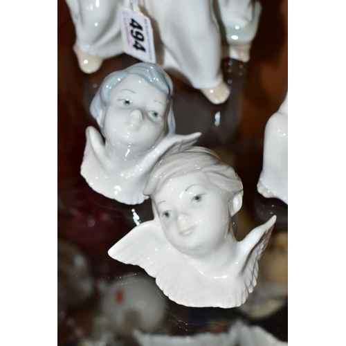 494 - THREE LLADRO FIGURES AND TWO LLADRO WALL MASKS, comprising  'Angel's Group', three angels singing fr... 