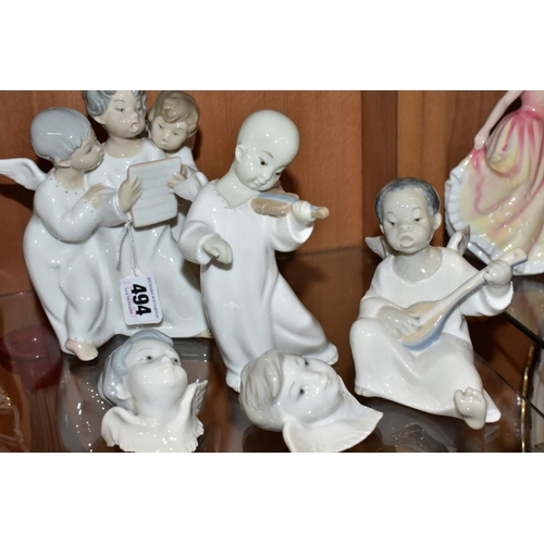 494 - THREE LLADRO FIGURES AND TWO LLADRO WALL MASKS, comprising  'Angel's Group', three angels singing fr... 