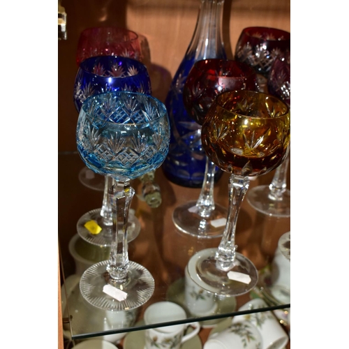 507 - A BOHEMIAN GLASS CUT TO CLEAR DECANTER WITH EIGHT HOCK GLASSES, comprising a cobalt blue cut to clea... 