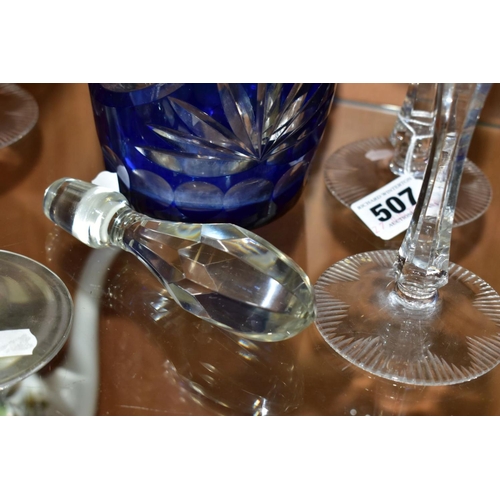 507 - A BOHEMIAN GLASS CUT TO CLEAR DECANTER WITH EIGHT HOCK GLASSES, comprising a cobalt blue cut to clea... 