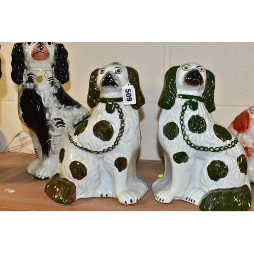 509 - THREE PAIRS OF STAFFORDSHIRE SPANIELS, comprising a pair with copper lustre details (lustre worn) he... 