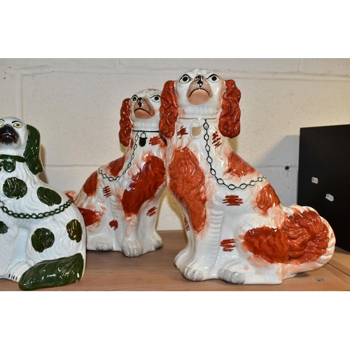 509 - THREE PAIRS OF STAFFORDSHIRE SPANIELS, comprising a pair with copper lustre details (lustre worn) he... 