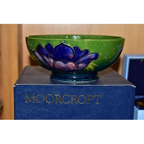 517 - A BOXED MOORCROFT ANENOME BOWL, with tubelined pink and purple anemones on a green/blue ground, diam... 