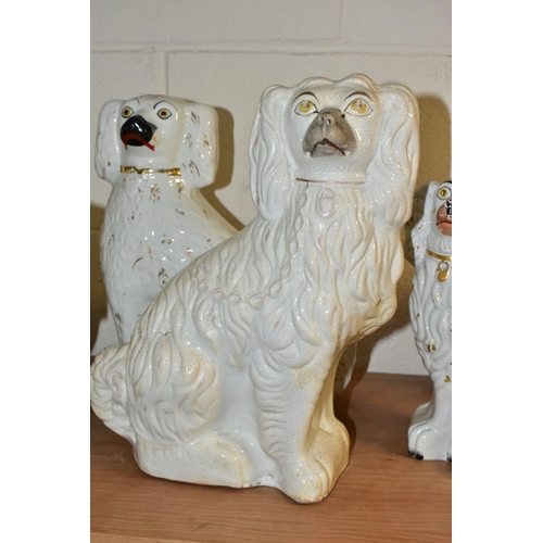 522 - SIX STAFFORDSHIRE SPANIELS, white glazed with gilt details, comprising two pairs approximate heights... 