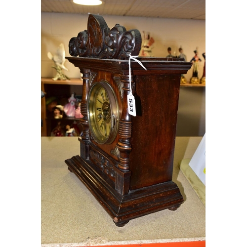 533 - A LATE 19TH CENTURY WALNUT AND STAINED MANTEL CLOCK, foliate carved pediment, printed dial with Roma... 