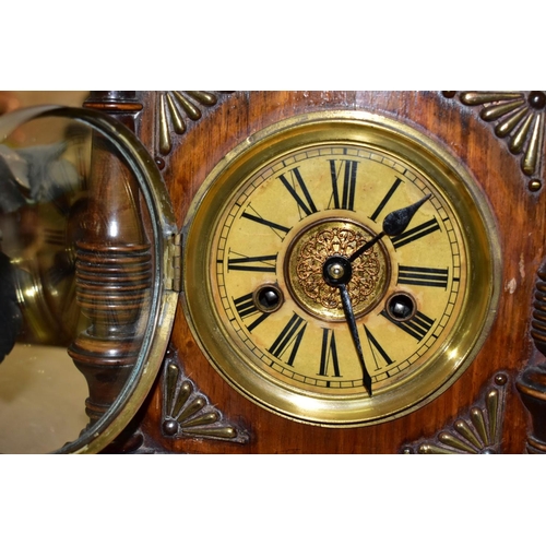 533 - A LATE 19TH CENTURY WALNUT AND STAINED MANTEL CLOCK, foliate carved pediment, printed dial with Roma... 