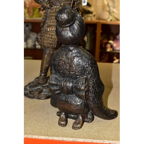 535 - A 20TH CENTURY PATINATED BRONZE FIGURE OF A SAMURAI  WARRIOR, cast as standing with a staff and hold... 