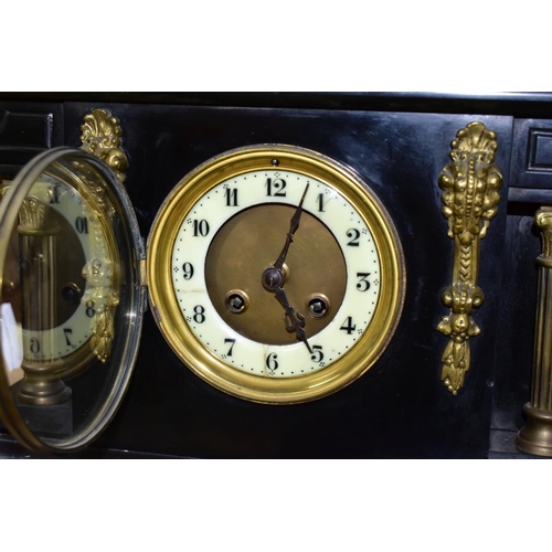 537 - A LATE VICTORIAN BLACK SLATE MANTEL CLOCK OF ARCHITECTURAL FORM, enamel dial with Arabic numerals, c... 