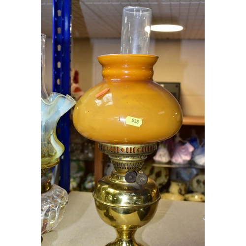 538 - A LATE VICTORIAN GILT METAL BASED OIL LAMP, with vaseline glass shade of wavy outline, the clear gla... 