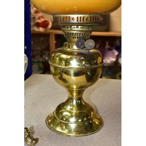 538 - A LATE VICTORIAN GILT METAL BASED OIL LAMP, with vaseline glass shade of wavy outline, the clear gla... 