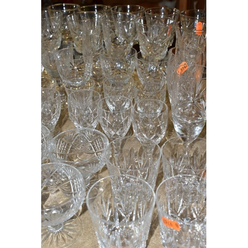 541 - A QUANTITY OF CUT GLASS DRINKING GLASSES, twelve sets/part sets of glasses with some pairs and singl... 