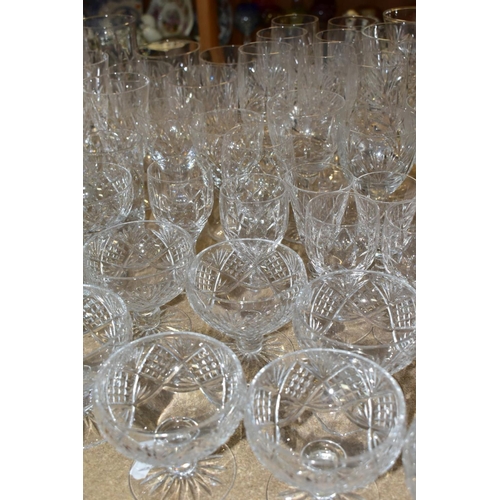 541 - A QUANTITY OF CUT GLASS DRINKING GLASSES, twelve sets/part sets of glasses with some pairs and singl... 