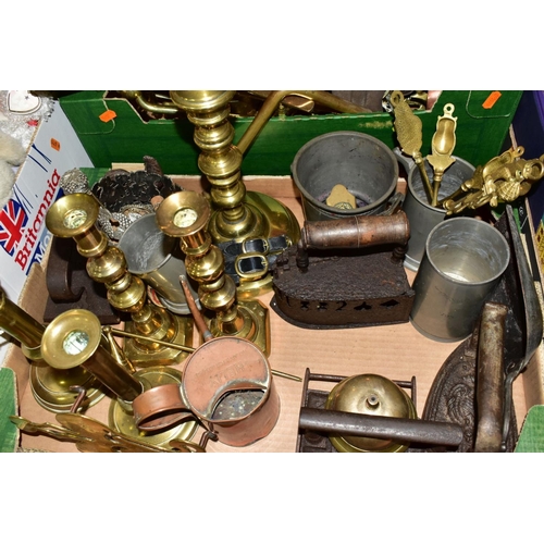 547 - TWO BOXES OF METALWARES, to include brass trivets, horse brasses, a copper ring mould, brass candles... 