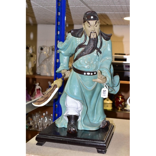 551 - A PAIR OF MODERN JAPANESE POTTERY FIGURES OF SAMURAI WARRIORS, posed holding bladed staff which is r... 