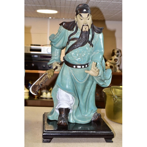 551 - A PAIR OF MODERN JAPANESE POTTERY FIGURES OF SAMURAI WARRIORS, posed holding bladed staff which is r... 