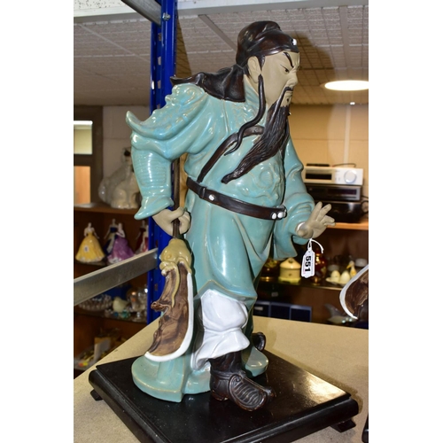 551 - A PAIR OF MODERN JAPANESE POTTERY FIGURES OF SAMURAI WARRIORS, posed holding bladed staff which is r... 