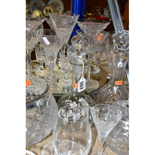 552 - A QUANTITY OF CUT CRYSTAL AND OTHER GLASSWARES, approximately sixty pieces to include a Dartington d... 