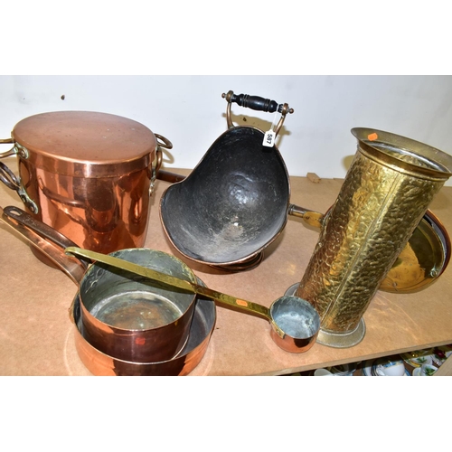 587 - A SMALL GROUP OF LARGE BRASS AND COPPER ITEMS, seven pieces, comprising two copper saucepans one sta... 