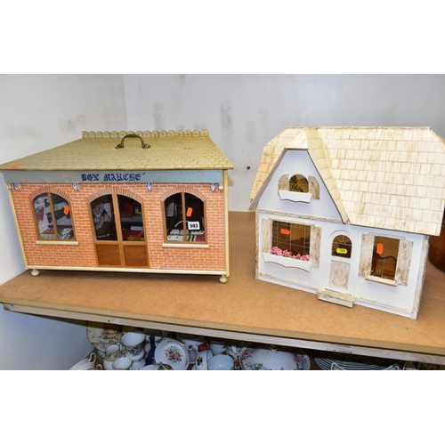 593 - A WOODEN MODEL DRAPER'S SHOP AND DOLLS HOUSE, the draper's shop having access through the half openi... 