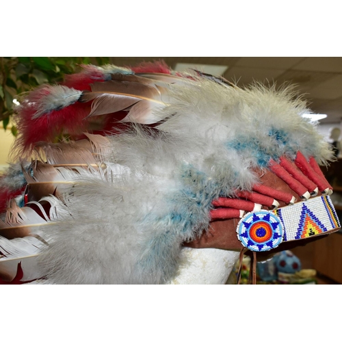 671 - A NATIVE CANADIAN / AMERICAN STYLE HEADRESS, together with a bow and two arrows with label descripti... 