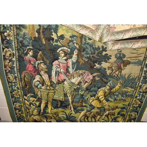 673 - FIVE TAPESTRY WALL HANGINGS TOGETHER WITH FOUR BRASS SUPPORTS, the largest depicting a hunting scene... 