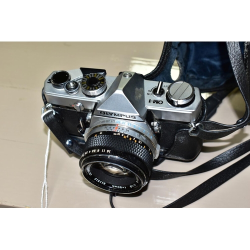 679 - AN OLYMPUS OM-1 35MM SLR CAMERA, fitted with an Olympus Zuiko 50mm f1.8 lens, together with a leathe... 