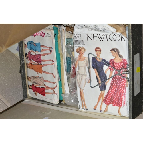 712 - A BOXED KNITTING MACHINE AND THREE BOX FILES OF SEWING PATTERNS, to include a boxed Tur Mix SV577 kn... 