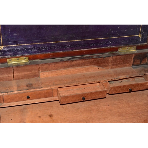 729 - A LARGE MAHOGANY CAMPAIGN STYLE WRITING SLOPE, in need of some restoration, with brass banding, an i... 