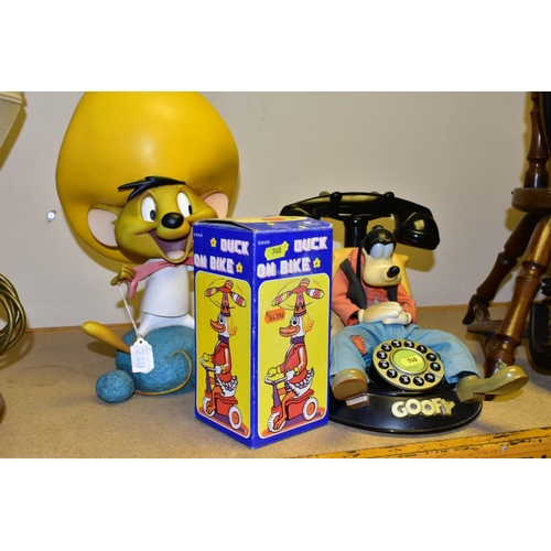 740 - A WARNER BROS 'GOOFY' PUSH BUTTON PHONE (mybelle805), a wind up tin duck on a bike (boxed), also inc... 