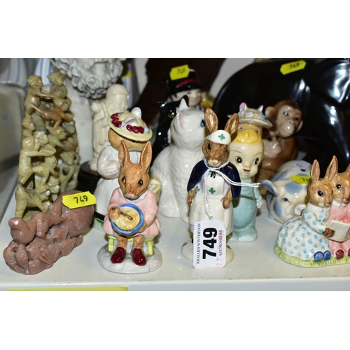 749 - A MIXED QUANTITY OF ROYAL DOULTON FIGURINES 'BUNNYKINS' ETC, a toby jug, a carved wooden Buddha 33cm... 