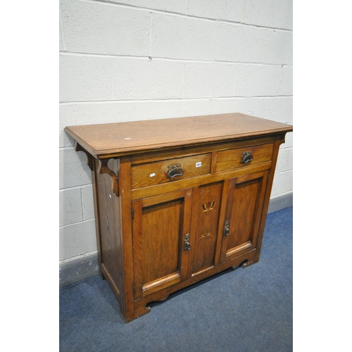 1641 - AN ARTS AND CRAFTS OAK SIDEBOARD, with two drawers over double cupboard doors, width 121cm x depth 5... 