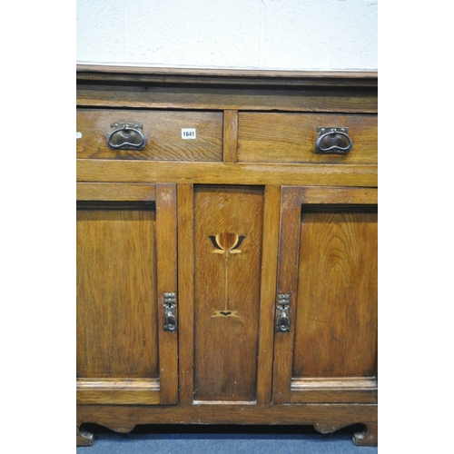 1641 - AN ARTS AND CRAFTS OAK SIDEBOARD, with two drawers over double cupboard doors, width 121cm x depth 5... 