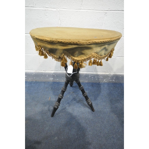 1654 - A VICTORIAN EBONISED GYPSY TABLE, the circular top with a gold fabric and tassels, on turned support... 