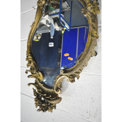 1656 - A 19TH CENTURY GILT FRAMED ROCOCO WALL MIRROR, 52cm x 90cm