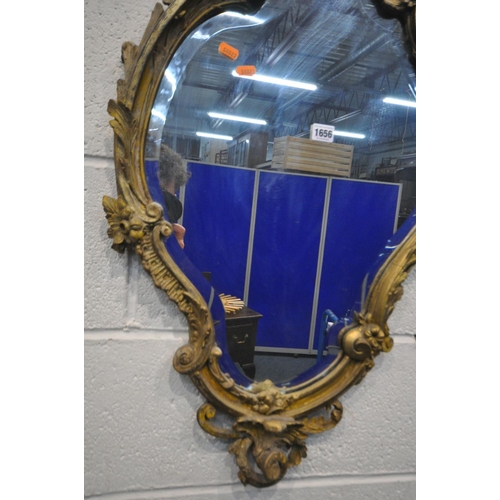 1656 - A 19TH CENTURY GILT FRAMED ROCOCO WALL MIRROR, 52cm x 90cm