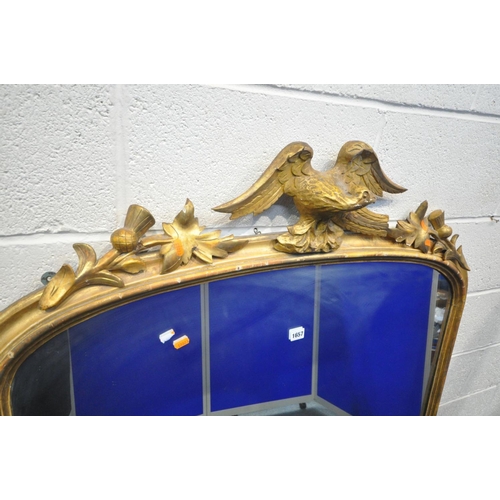 1657 - A 19TH CENTURY GILTWOOD OVERMANTEL MIRROR, with foliate decoration flanking an eagle surmount, width... 