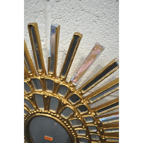 1659 - A GILT FRAMED SUNBURST WALL MIRROR (condition:-multiple loose mirror plates and loose gilding) an ov... 