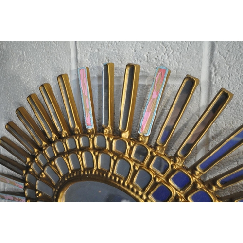 1659 - A GILT FRAMED SUNBURST WALL MIRROR (condition:-multiple loose mirror plates and loose gilding) an ov... 