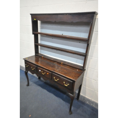 1660 - A GEORGIAN OAK DRESSER, with a triple cascading plate rack, and three frieze drawers, on cabriole fr... 