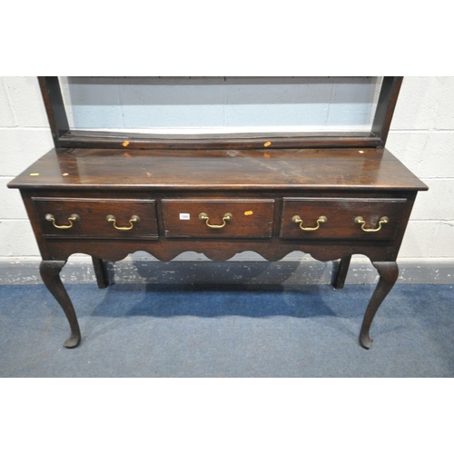 1660 - A GEORGIAN OAK DRESSER, with a triple cascading plate rack, and three frieze drawers, on cabriole fr... 