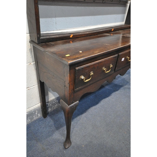 1660 - A GEORGIAN OAK DRESSER, with a triple cascading plate rack, and three frieze drawers, on cabriole fr... 