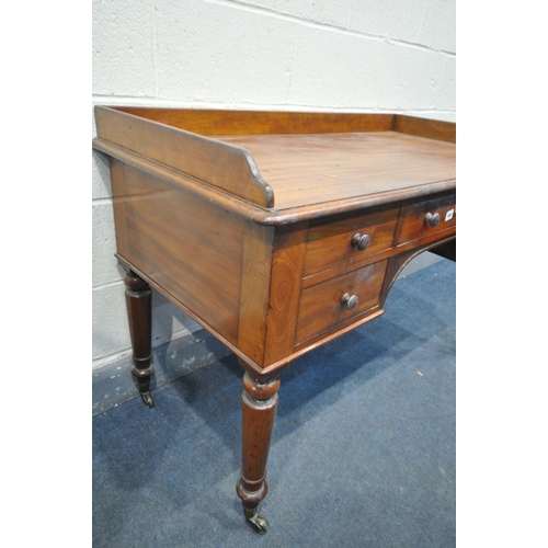 1665 - A VICTORIAN MAHOGANY DESK, with a gallery back and sides, five assorted drawers, on turned legs and ... 