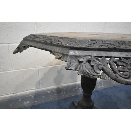 1667 - A 19TH CENTURY EBONISED CARVED WOOD OCTAGONAL TRIPOD OCCASIONAL TABLE, the top with a multi wood par... 