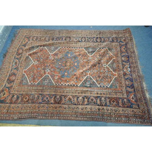 1669 - A 19TH CENTURY MIDDLE EASTERN HAND WOVEN RED HERIZ RUG, 160cm x 210cm, and a gold foliate rug (2)