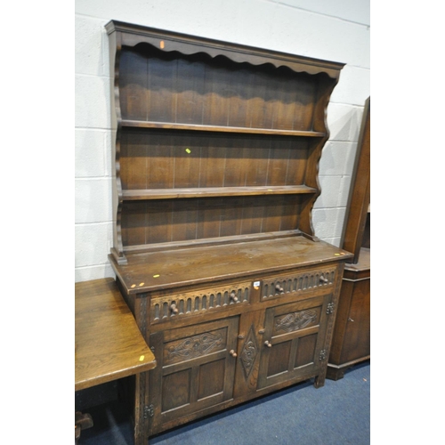 1681 - AN OAK DRESSER with a two tier plate rack and two drawers, width 130cm x depth 42cm x height 172cm x... 